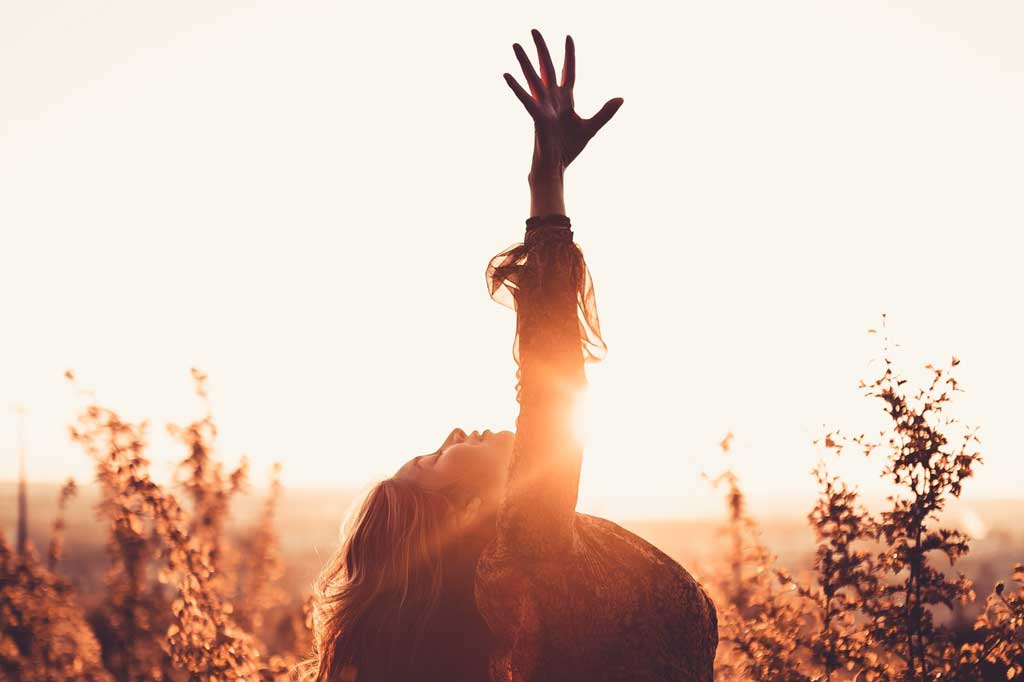 A dancer with a raised arm in the air